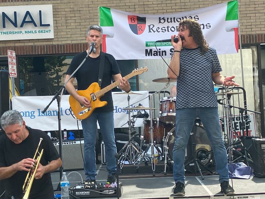 Killin’ Time performs The Temptations’ hit “My Girl” during the Saint Liberata Feast on Saturday in downtown Patchogue.